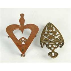 TWO DECORATIVE TRIVETS