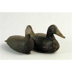 TWO ANTIQUE CARVED AND PAINTED BLACK DUCKS