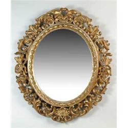 OUTSTANDING 19TH CENTURY ORNATELY CARVED GILT OVAL MIRROR