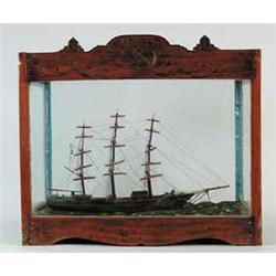 INTERESTING WATERLINE SHIP MODEL IN SAILOR MADE CARVED CASE