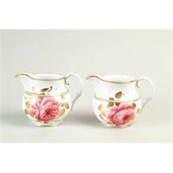 RARE PAIR OF FLOWER DECORATED PORCELAIN PITCHERS