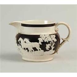 INTERESTING RELIEF DECORATED SMALL PITCHER ATTRIBUTED TO TURNER