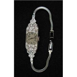 DIAMOND, PLATINUM AND GOLD LADIES WRISTWATCH BY AUDEMARS PIQUET