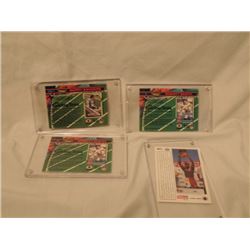 4 TOPPS FOOTBALL CARDS IN CASES