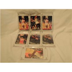 7 NBA BASKETBALL CARDS IN CASES AS SHOWN