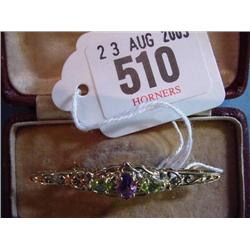 9ct.Gold Bar Brooch Set With Peridot And Amethyst...