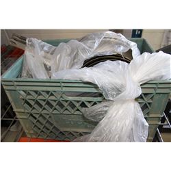 GREEN CRATE FILLED WITH FRYING PANS