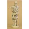 Image 1 : CARVED IVORY FIGURE OF A FARMER, Japanese. Signed in a cinnabar seal. Carrying a hoe and a stra...