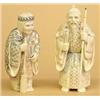 Image 1 : PAIR OF CARVED IVORY FIGURES, Japanese. Signed in a cinnabar seal. Of an elderly man holding a...