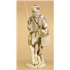 Image 1 : CARVED IVORY FIGURE OF A FISHERMAN, Japanese. 20th Century. Walking among tree trunks with a st...