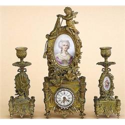 THREE PIECE LOUIS XVI STYLE GILT BRONZE AND PORCELAIN CLOCK GARNITURE, European. Late 19th Cent...