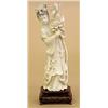 Image 1 : CARVED IVORY FIGURE OF GUANYIN, Chinese. The immortal wearing a long robe tied at the waist hol...