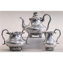 THREE PIECE VICTORIAN STERLING SILVER ASSEMBLED TEA SERVICE, English. London. 1848 and 1866. Ma...
