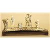Image 1 : CARVED IVORY GROUP, Chinese. Of a man, a woman and a boy standing next to a table with an open...