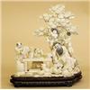 Image 1 : LARGE CARVED IVORY GROUP, Chinese. Of an elder seated under a pine tree surrounded by five pupi...