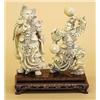 Image 1 : TWO CARVED IVORY FIGURES OF WARRIORS, Chinese. Each wearing elaborate full armor, one holding l...