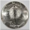 Image 2 : 1986 AMERICAN SILVER EAGLE, ICGA PERFECT GEM BU  FIRST YEAR OF ISSUE