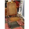Image 1 : WOOD WICKER AND METAL ROCKING CHAIR