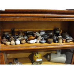 Shelf of collectible pottery