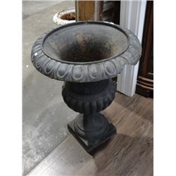 Pair of black cast iron urns one has chip
