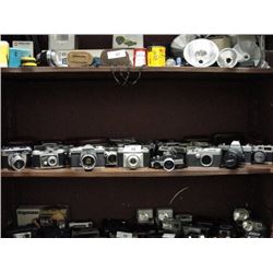 Shelf of vintage cameras