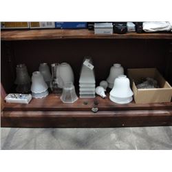 Shelf of lamp shades etc