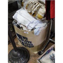 Box of linens and throw pillows