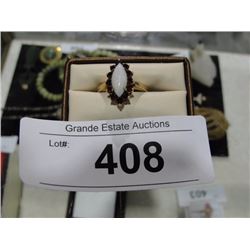 14kt gold white crystal opal and rhodolite garnet ring. Appraised value $850