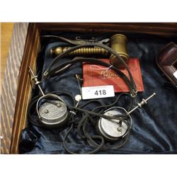 Brass gavel, 1895 Chicago tourist book, radio operator headphones