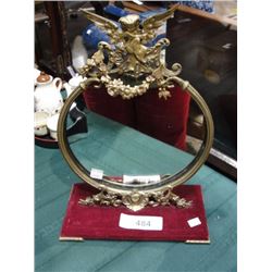 brass framed figural mirror