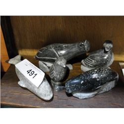 5 carved soapstone figures.