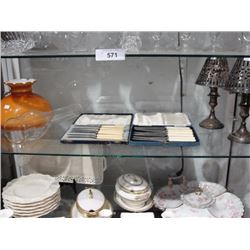 Shelf lot of lamp shades, fruit sets, and silverplate candlesticks