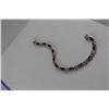 Image 2 : 6CT OVAL GARNET AND DIAMOND TENNIS BRACELET, FIGURE 8 LINKS, 12 OVAL GARNETS, INCLUDES $550