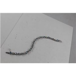 BLUE TOPAZ AND DIAMOND BRACELET, INFINITY LINK, 12 OVAL TOPAZES, APPROX RETAIL $400