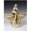 Image 1 : A Royal Dux figure modelled as a seated semi-clad female between two shells, pad mark to base,...