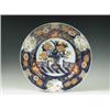 Image 1 : An Imari dish after an early 18th Century original, painted with a vase of flowers within an e...