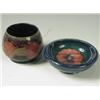Image 1 : A Moorcroft bowl in the Pomegranate pattern, 7cm high, and another, decorated with a pansy, 11...