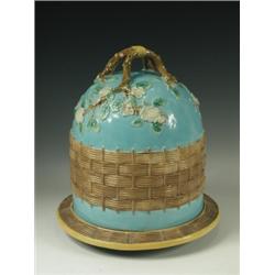 A George Jones majolica stilton dish, in the dogwood and woven fence pattern, unmarked, 31cm h...