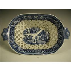 A blue and white pearlware chestnut basket printed with oriental figures drying nets, impresse...