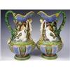 Image 1 : A pair of Minton Majolica ewers, decorated in relief with a cherub flanked by a merman and mer...