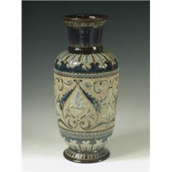 A Doulton Lambeth pottery vase by Eliza Simmance painted with blue foliate scrolls rosette mar...