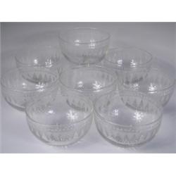 Eight 19th Century cut glass finger bowls each with an engraved beaded and dog tooth band and...
