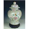 Image 1 : A late 19th Century Cantonese baluster vase and cover with characteristic decoration, on an as...