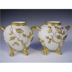 A pair of Victorian Royal Worcester vases with basket weave moulding and relief foliage decora...