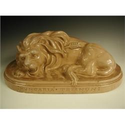 An early 20th Century Hungarian pottery lion, inscribed ':Hungaria . Trianon:', 60cm wide E...