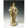 Image 1 : A Royal Dux figure of a farm hand with a sickle and wheat sheaf, 55cm high Est. 350/450...
