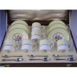 A Royal Worcester "Miranda" pattern demi-tasse coffee service with 6 Mappin & Webb silver gilt...