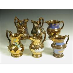 Six late 19th Century copper lustre jugs, each of different baluster form, one moulded with da...