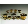 Image 1 : Six copper lustre salts, each raised on a low foot, a bowl, a goblet with a ribbed body and a...