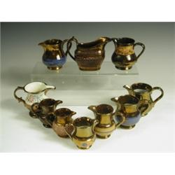 Ten small copper lustre jugs, nine of baluster shape, one marked Allertons, Longton, 8.5cm hig...